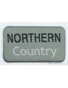 Tygmärke "northern Conuntry" grå